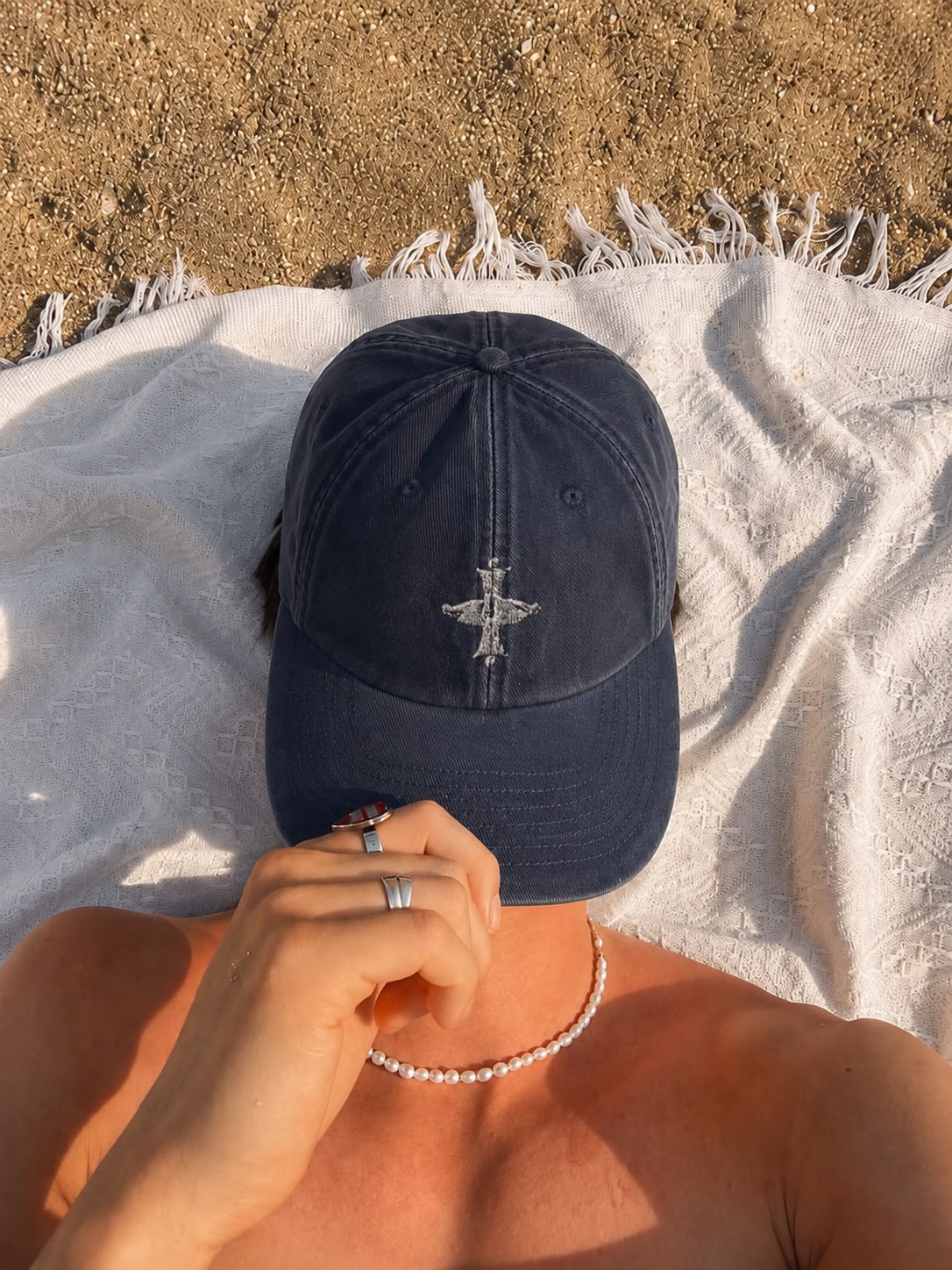 Palermo Bleu Cap — worn on the beach